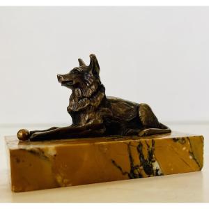 Bronze Dog With A Ball.